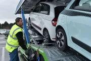 Renault Trucks driver attaching cars to be transported on a trailer